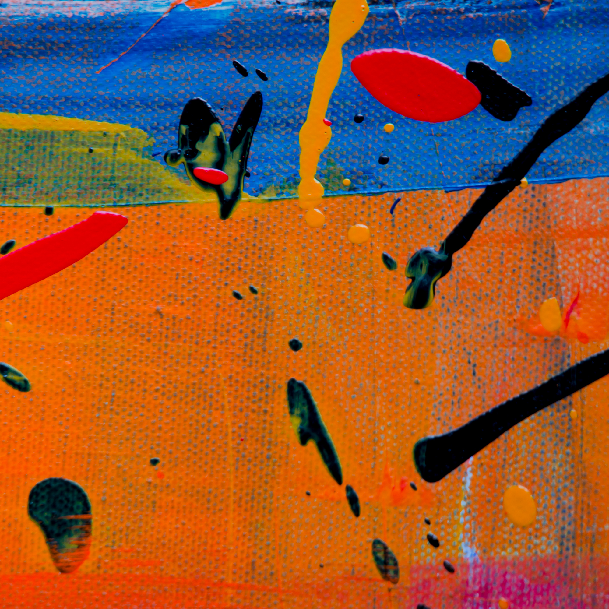 Young boy lining up toy cars with focus and care